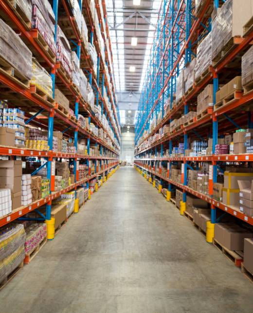 Boxes kept on row of shelves in the warehouse